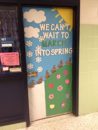 Seasonal transition classroom door with bunnies hopping from snow into a bright and sunny spring field.