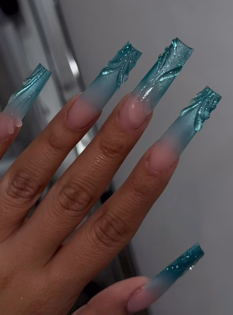Dreamy mermaid ocean nails with seashell textures, pearl accents, and glossy pastel beach-inspired nail art