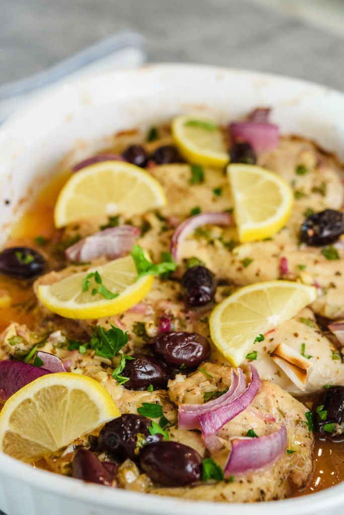 Greek Mediterranean chicken with fresh vegetables, olives, and bold herbs for a healthy summer dinner.
