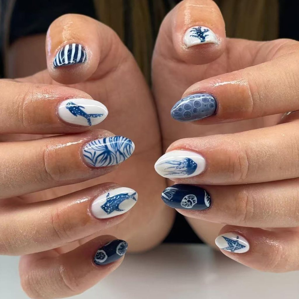 lemon themed summer nails with stripes and bright citrus design
