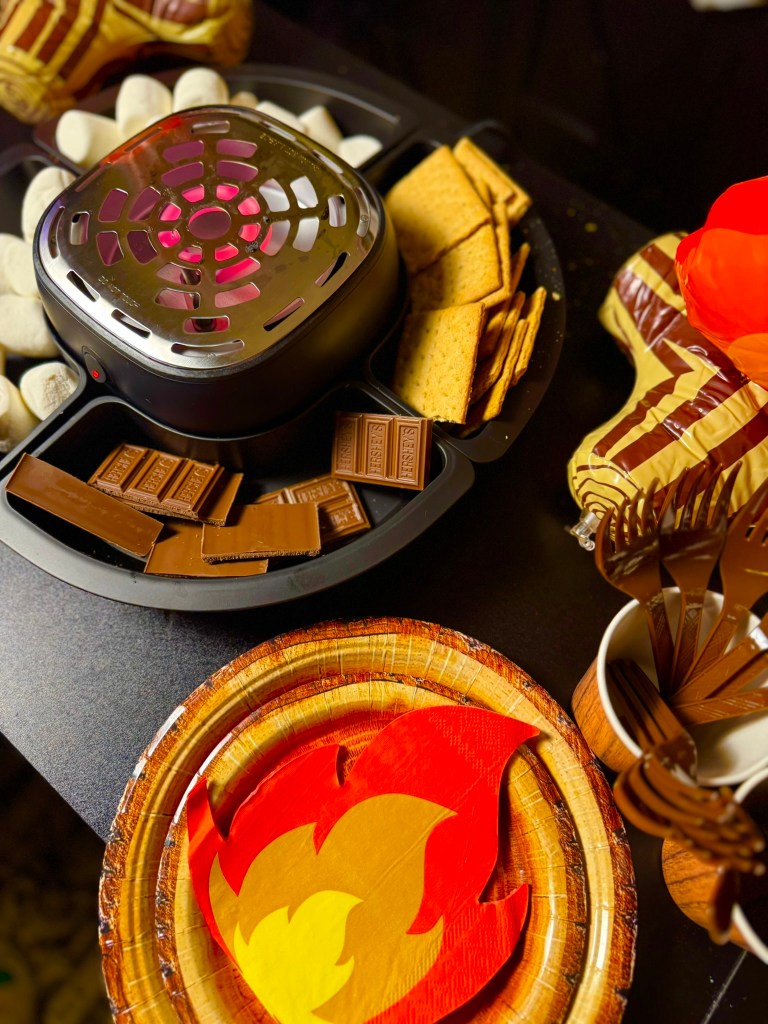 Indoor s’mores station for a kids camping themed birthday party.