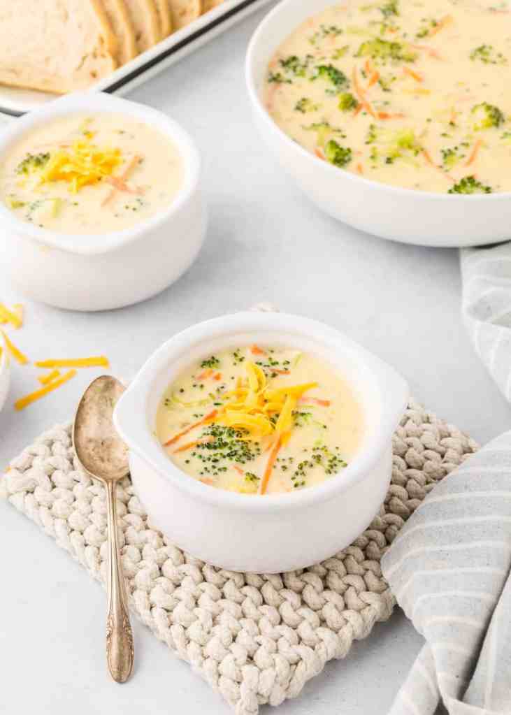 Homemade broccoli cheddar soup with fresh broccoli and creamy cheese base in a bowl