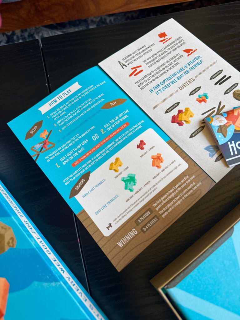 Instruction cards for a board game titled 'How to Play' outlining setup, gameplay, scoring, and winning conditions.
