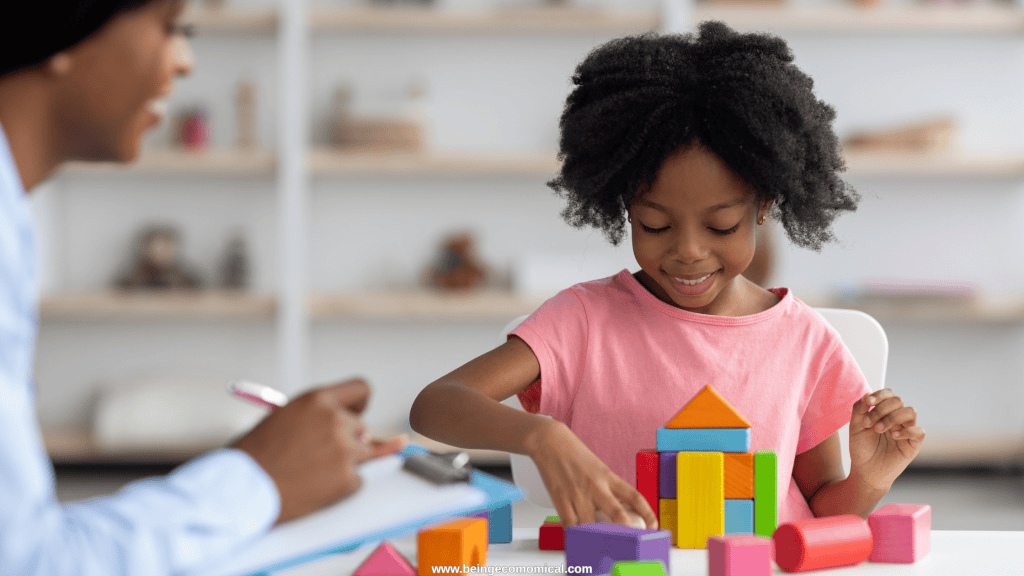 Four-year-old building with colorful blocks during a hands-on preschool learning activity.