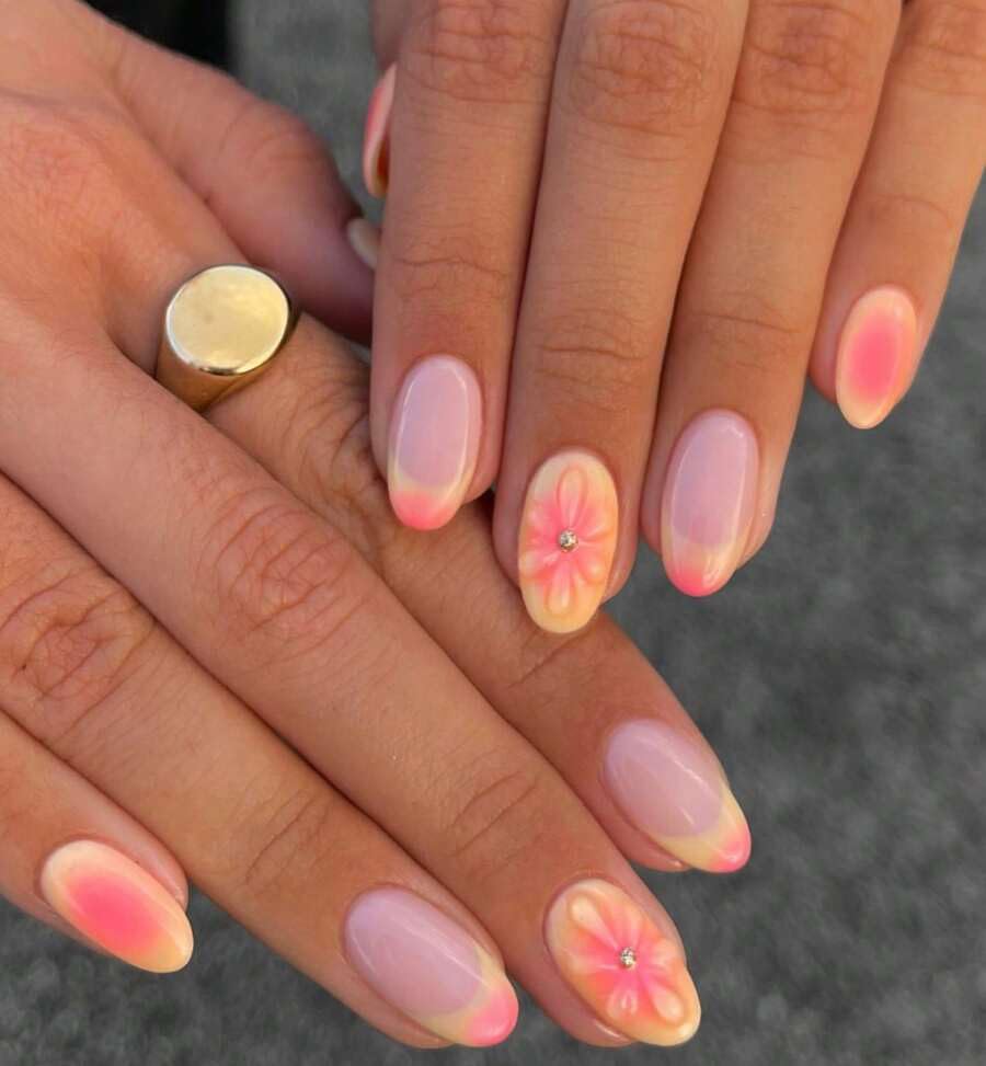 pink and orange ombre nails with soft floral summer design
