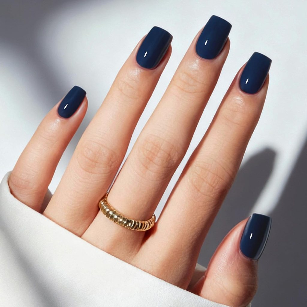 Matte dark navy blue square nails with a deep blue minimalist manicure and velvety matte finish.