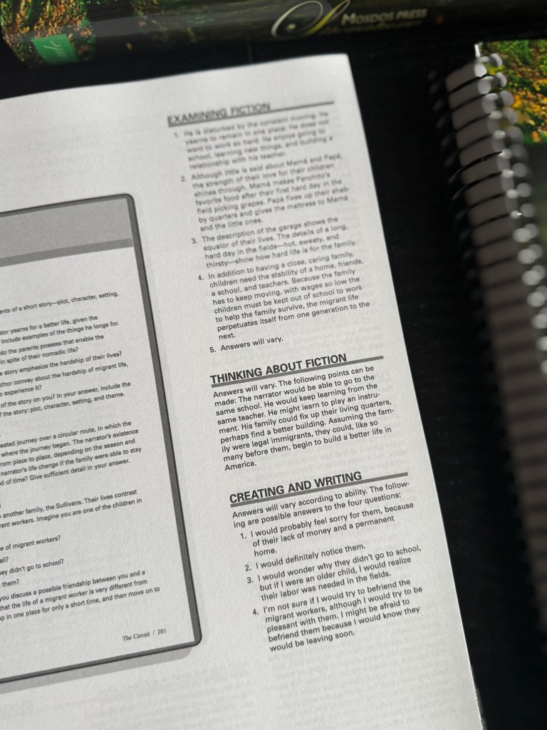 A close-up of a page from a literature textbook titled 'Examining Fiction,' containing sections on analyzing elements of a story, thinking about fiction, and creating writing assignments.