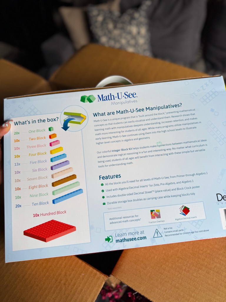 Back of the Math-U-See Integer Block Kit showing the included colorful math manipulatives.