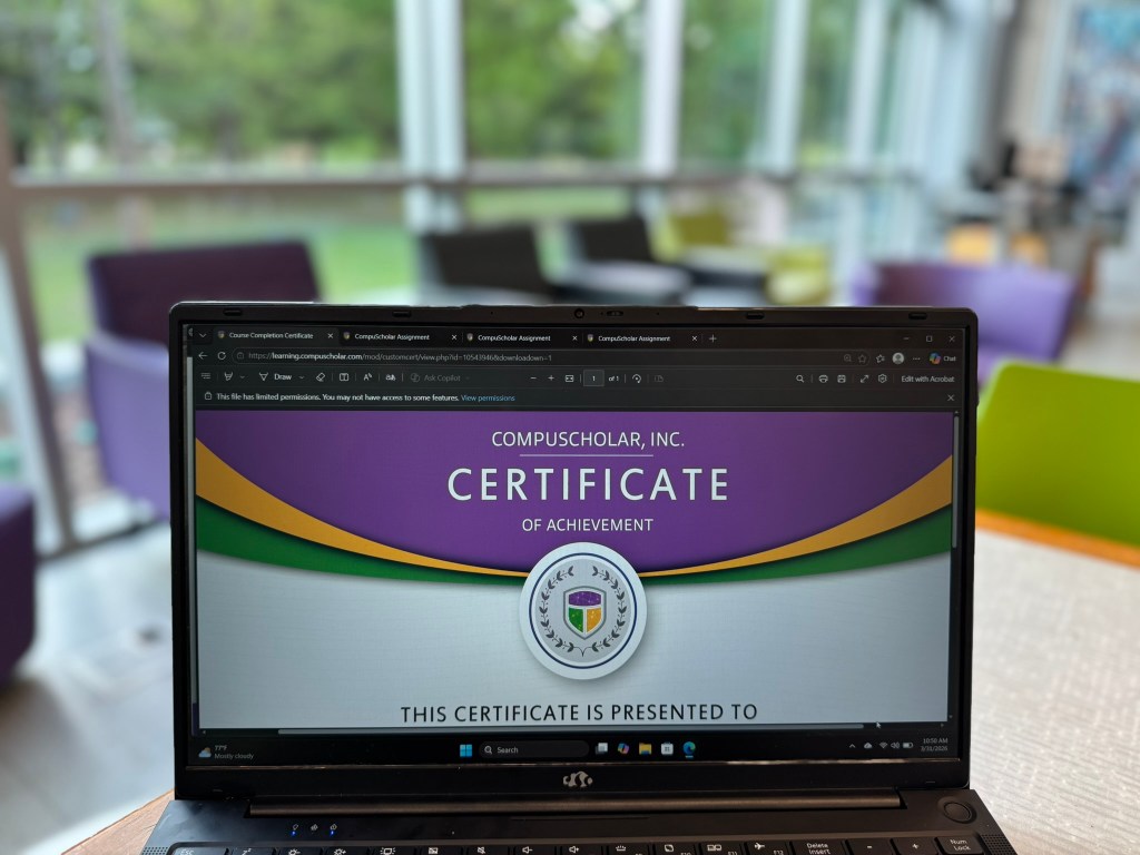 CompuScholar Python course certificate of achievement displayed on laptop after course completion