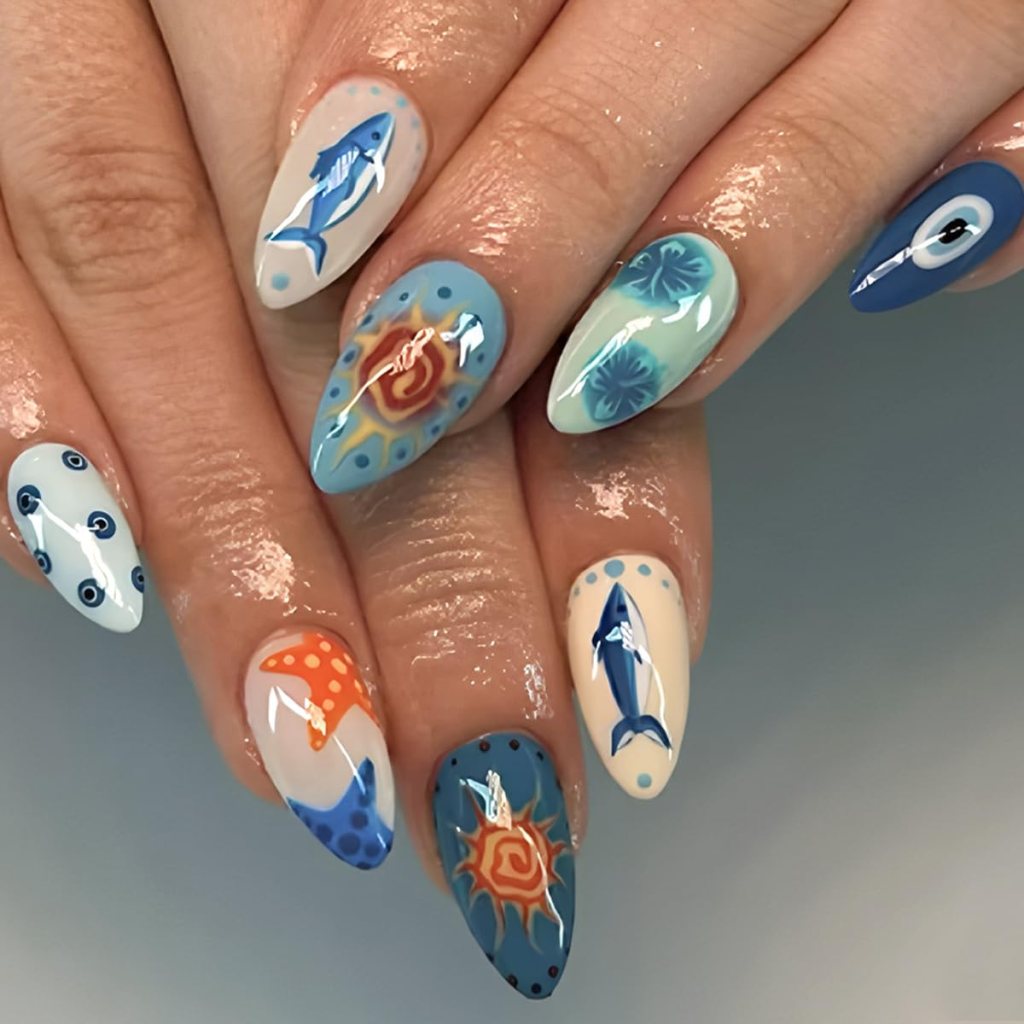 blue ocean summer nails with fish art and sea life design on almond shaped nails