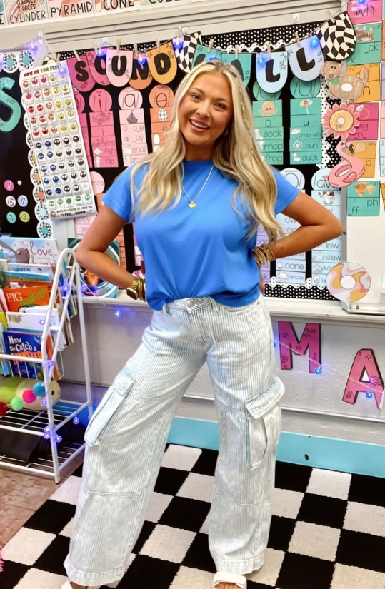 spring teacher outfit with bright top and striped pants