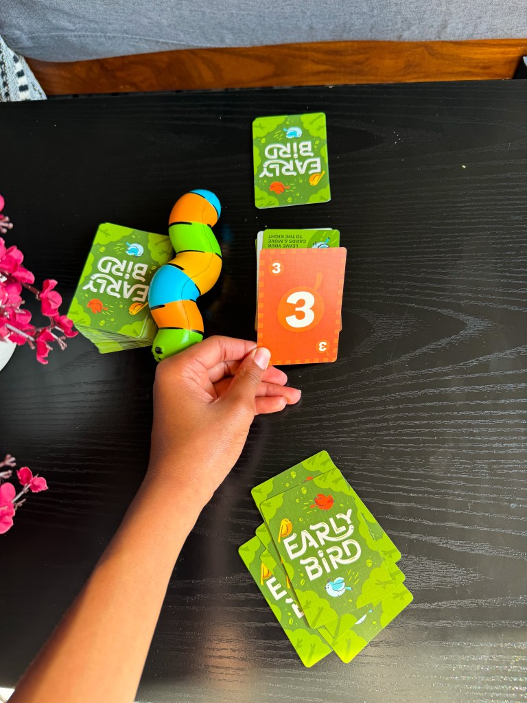 Child playing the Build a Birdhouse challenge card in the Early Bird game