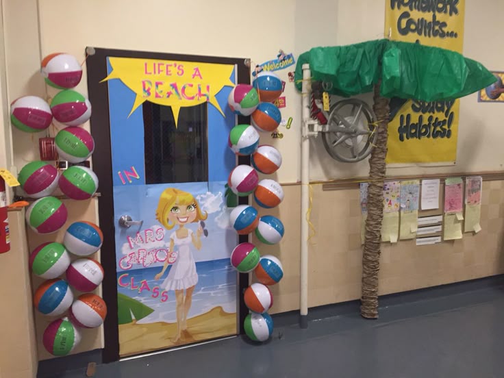 life’s a beach classroom door with beach balls and summer theme decorations