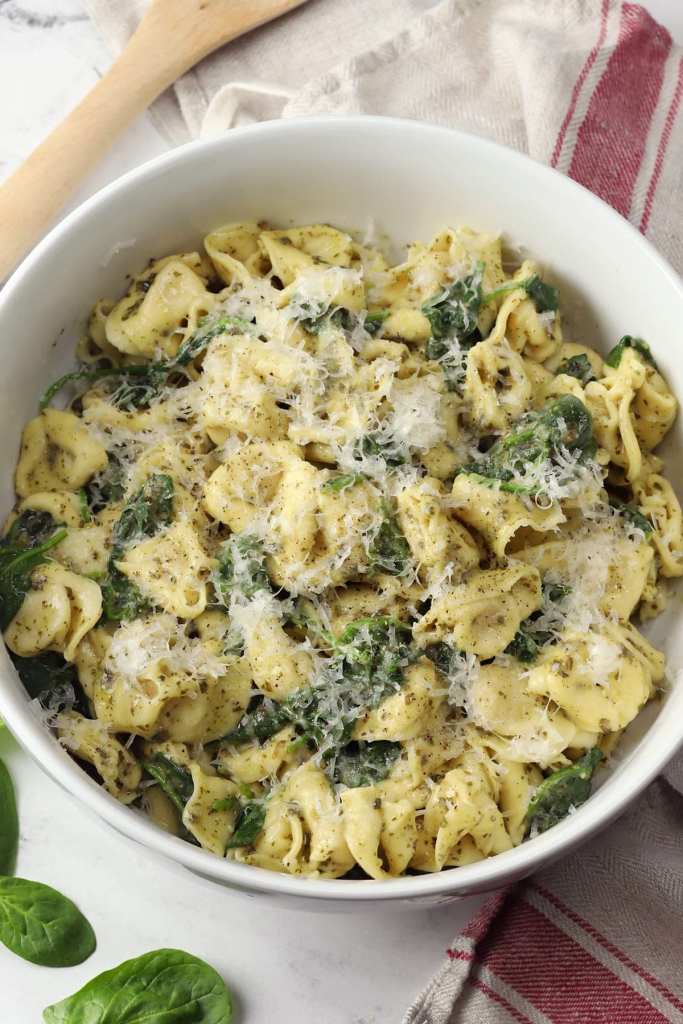 Pesto tortellini with spinach and cheese-filled pasta tossed in basil pesto sauce