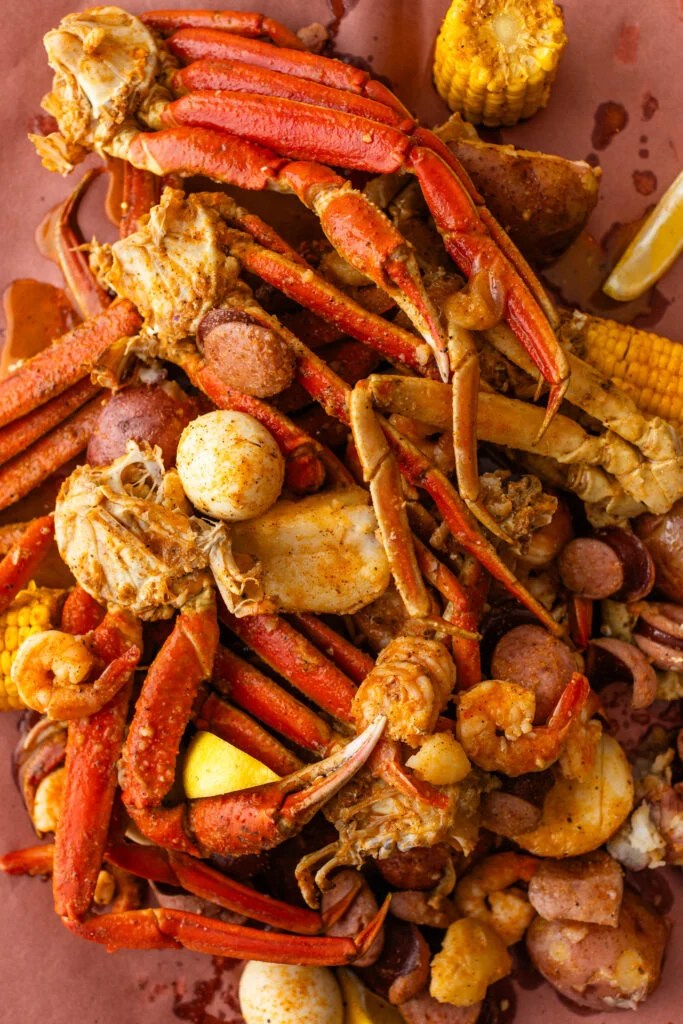 Louisiana seafood boil with shrimp, crab, sausage, corn, and potatoes tossed in Cajun butter sauce.