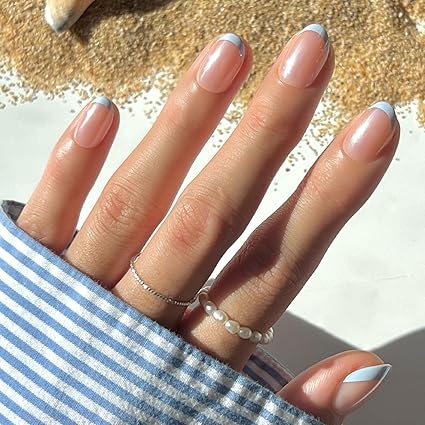 light blue french tip summer nails with minimal clean girl aesthetic on almond shaped nails