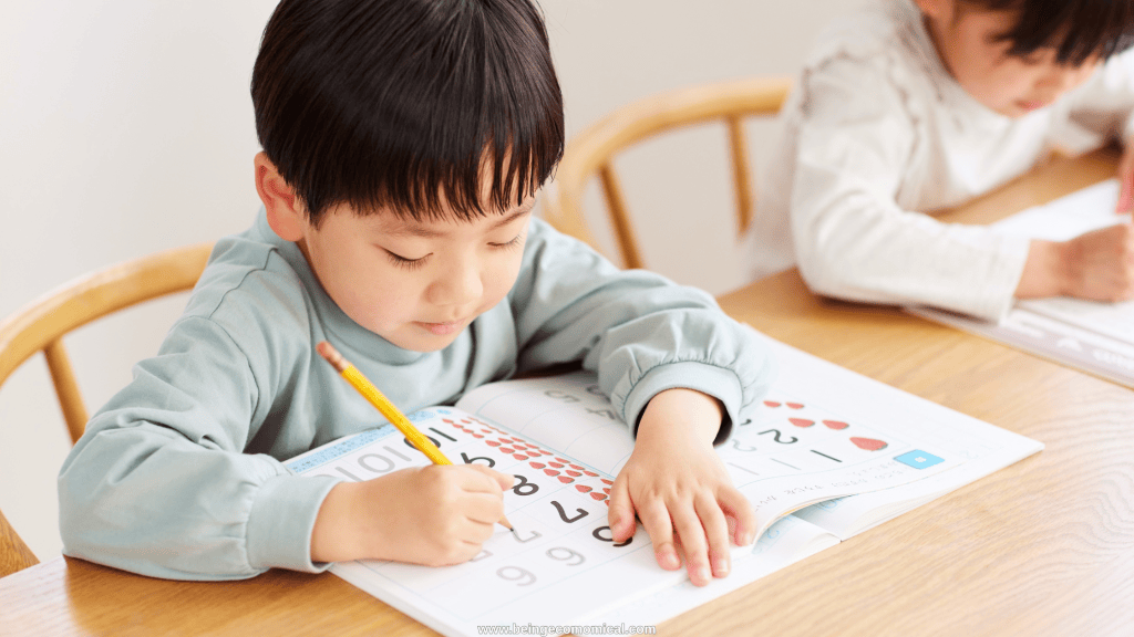 Four-year-old practicing numbers in a workbook for learning activity. 