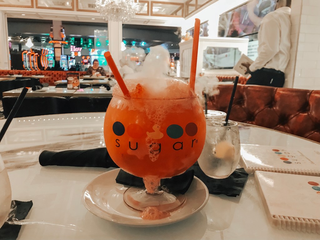 A colorful signature smoking goblet drink served at Sugar Factory Biloxi.