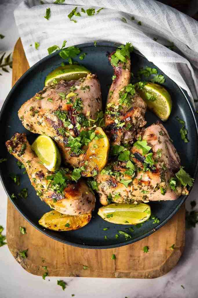 Cilantro lime chicken with fresh herbs and lime for a juicy summer grilling recipe.