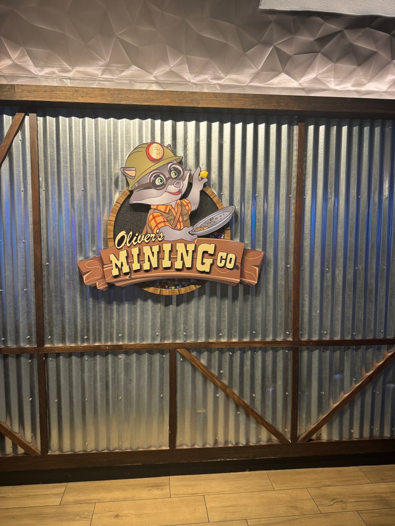 Oliver’s Mining Co. sign inside Great Wolf Lodge Grapevine, home to the resort’s gem mining activity.