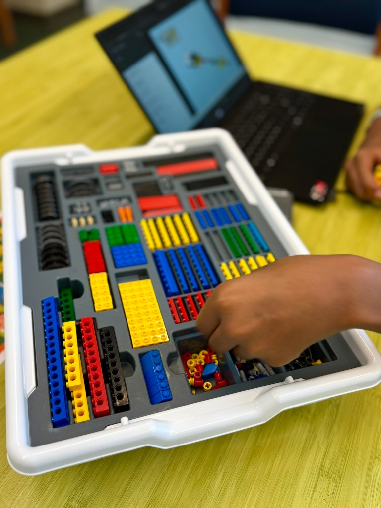 Student beginning a new iBrick project with online step-by-step instructions