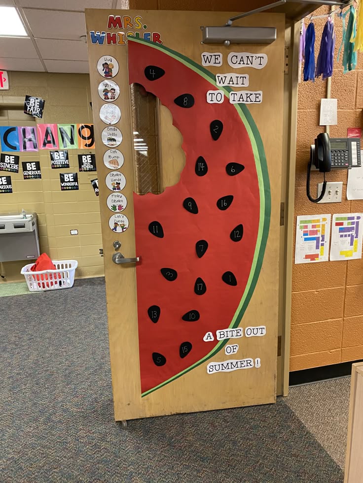 a bite out of summer classroom door with watermelon theme and bright colors