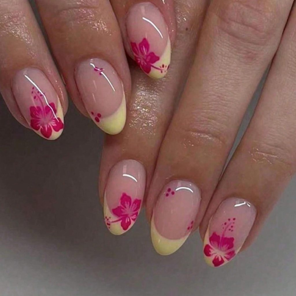 Butter yellow hibiscus floral nails with tropical flower nail art and glossy summer manicure design