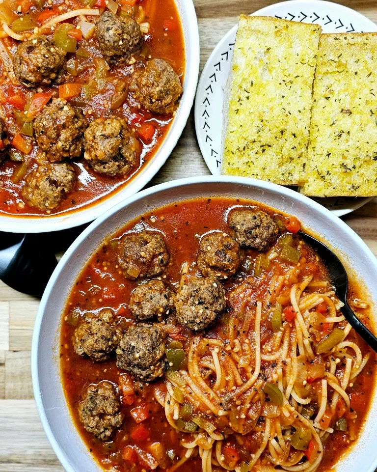 Spaghetti and meatball soup with mini meatballs in a rich tomato broth