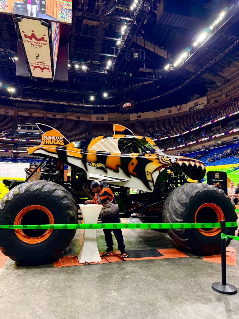 Tiger Shark monster truck with orange, black and white shark-inspired details at the preshow.