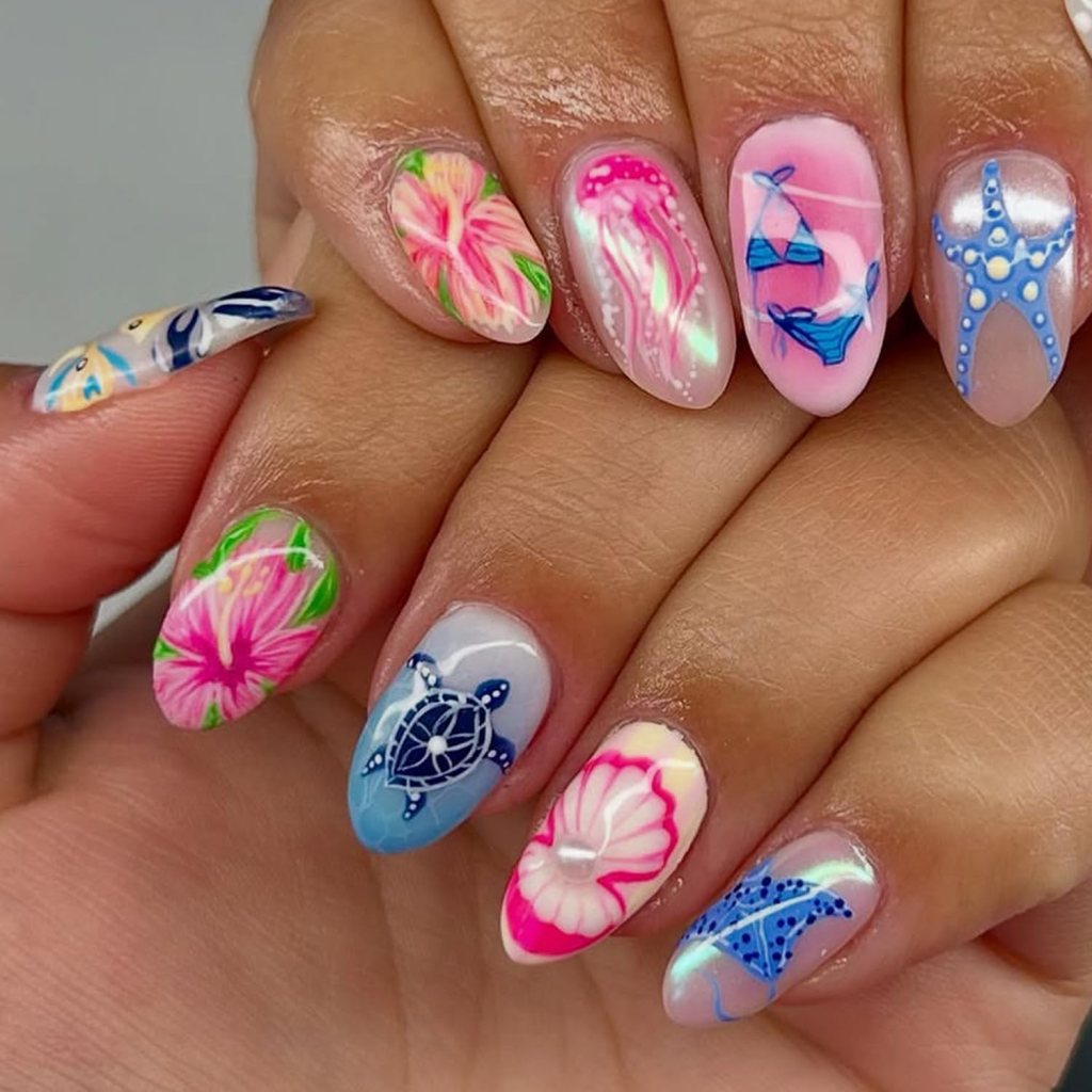Pink tropical ocean nails with jellyfish art, seashell details, hibiscus flowers, and beach-inspired summer colors