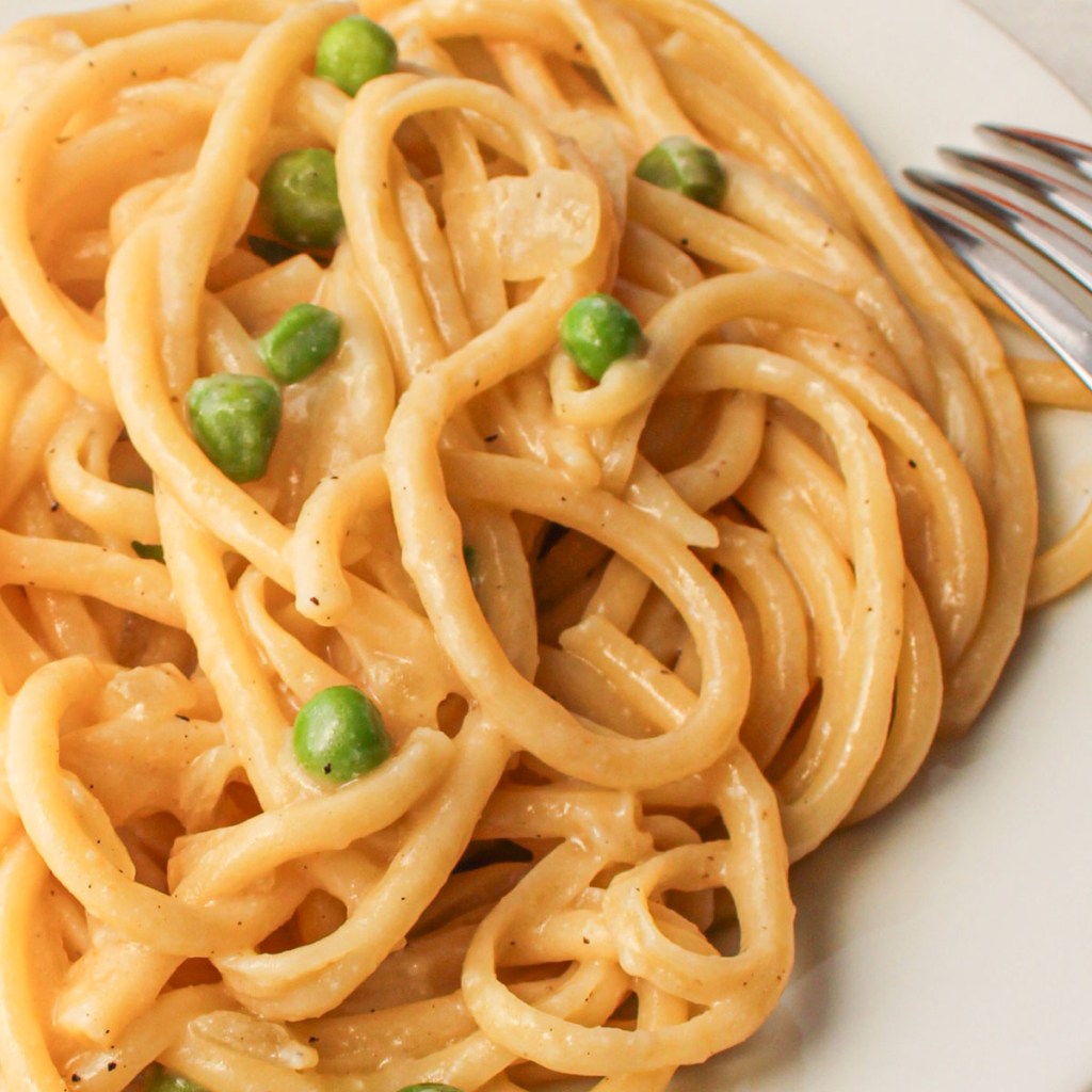 Creamy vegan pasta with peas made with simple ingredients for a quick plant-based dinner