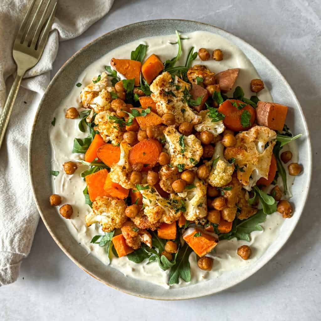 healthy nourish bowl with roasted vegetables and chickpeas