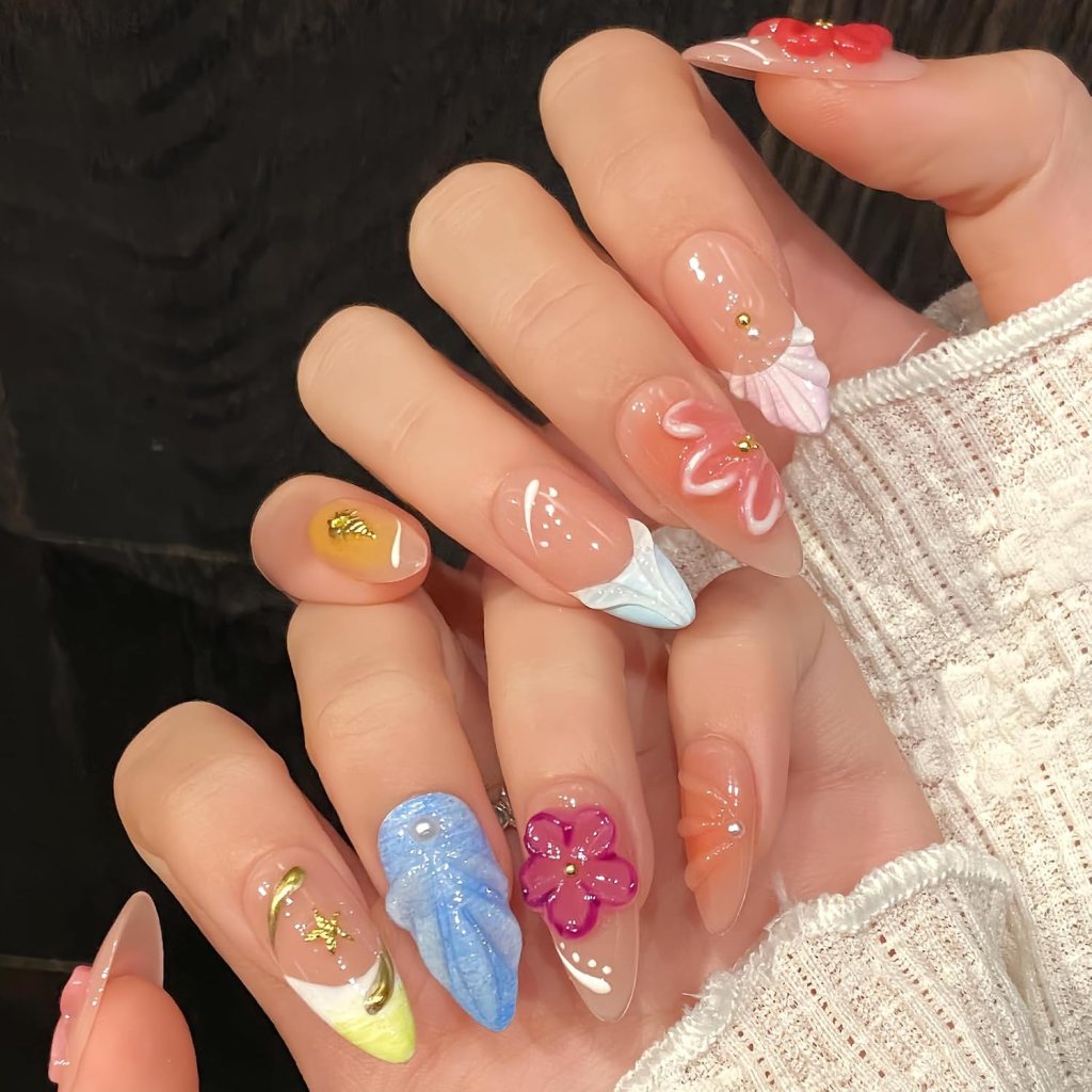 Pastel seashell ocean nails with 3D flowers, colorful beach-inspired details, and glossy summer manicure design