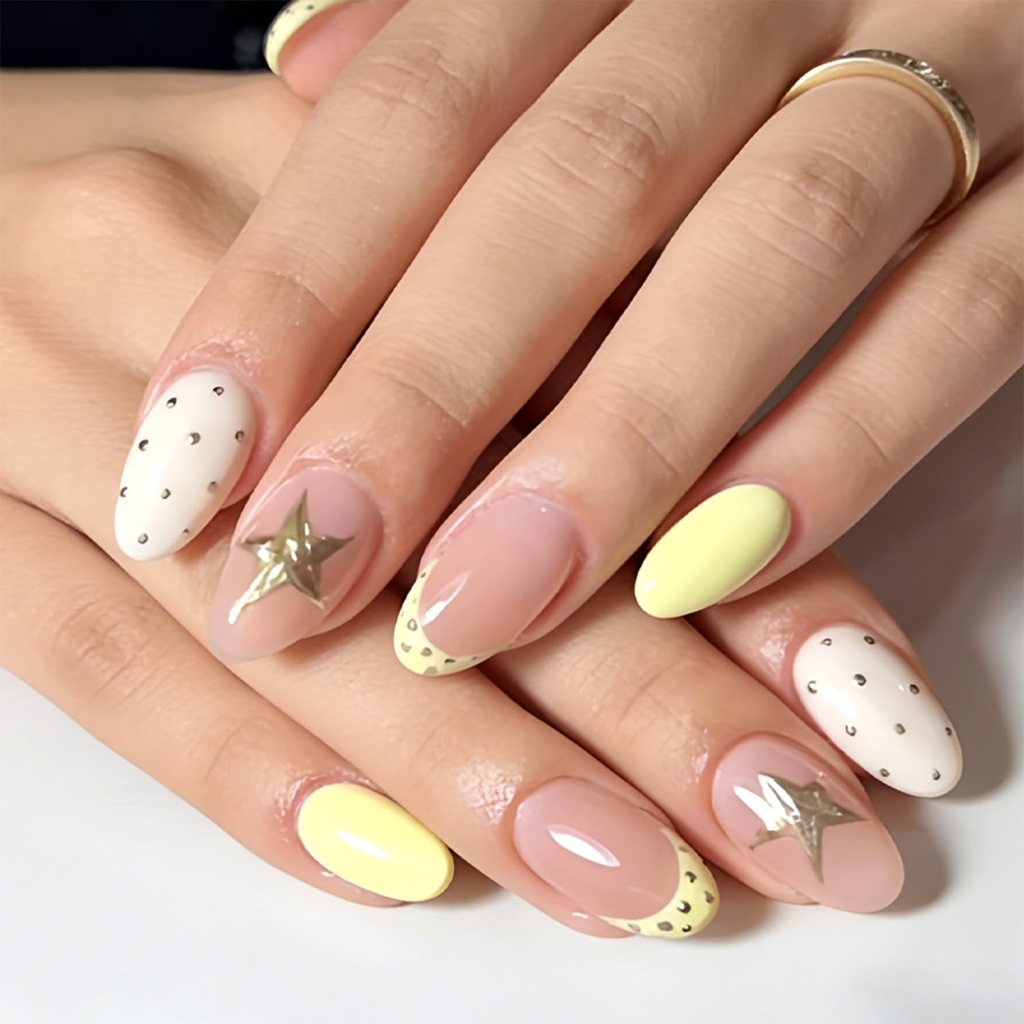 Butter yellow star accent nails with minimalist celestial nail art and glossy pastel manicure finish