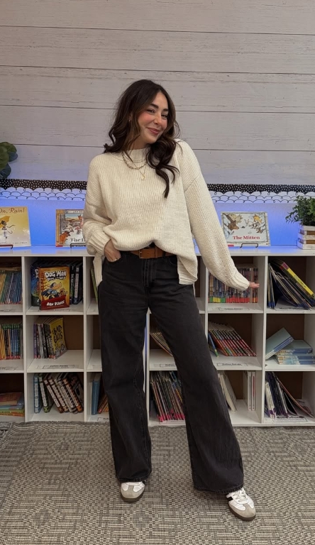 casual teacher outfit with cream sweater and black jeans
