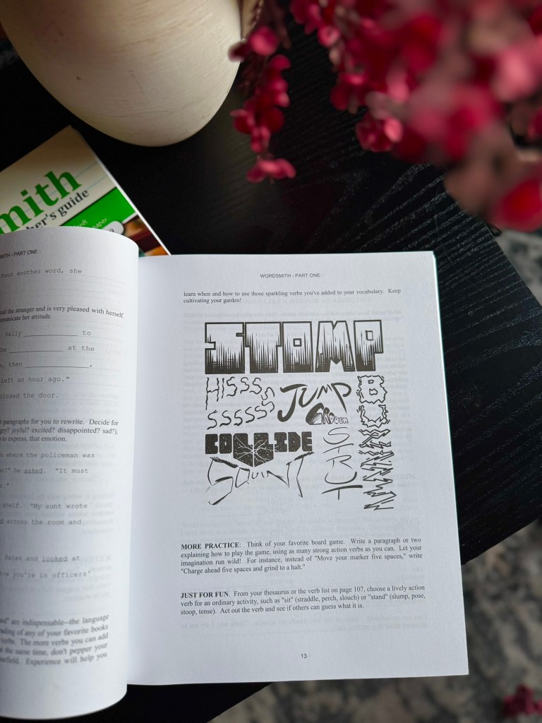 A close-up of an open book page featuring the title 'STAMP' in bold, stylized letters, surrounded by various drawn sound effects like 'HISS', 'JUMP', and 'COLLIDE'. The page outlines vocabulary practice exercises and includes illustrative doodles.