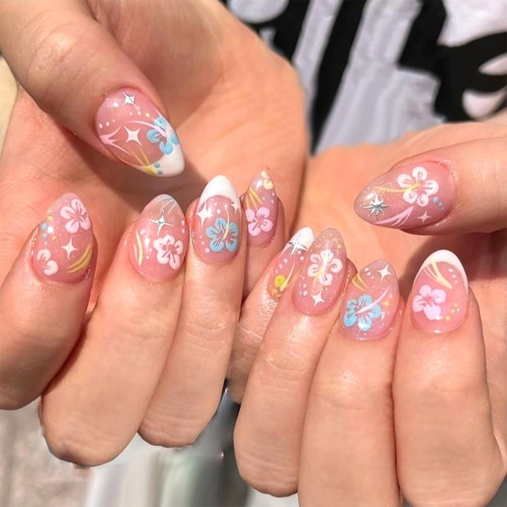 pink hibiscus tropical summer nails with bold floral design and glossy finish