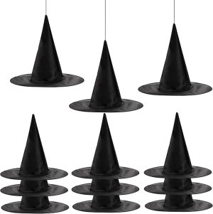 A collection of black witch hats displayed in a playful arrangement, perfect for Halloween decor.
