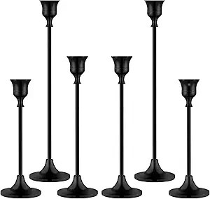 A set of six elegant black candle holders, varying in height, designed to hold taper candles. Ideal for adding a sophisticated touch to dining tables or event decorations.