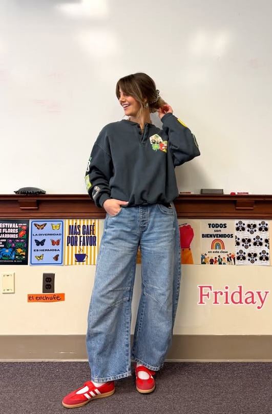 casual teacher outfit with graphic sweatshirt and sneakers