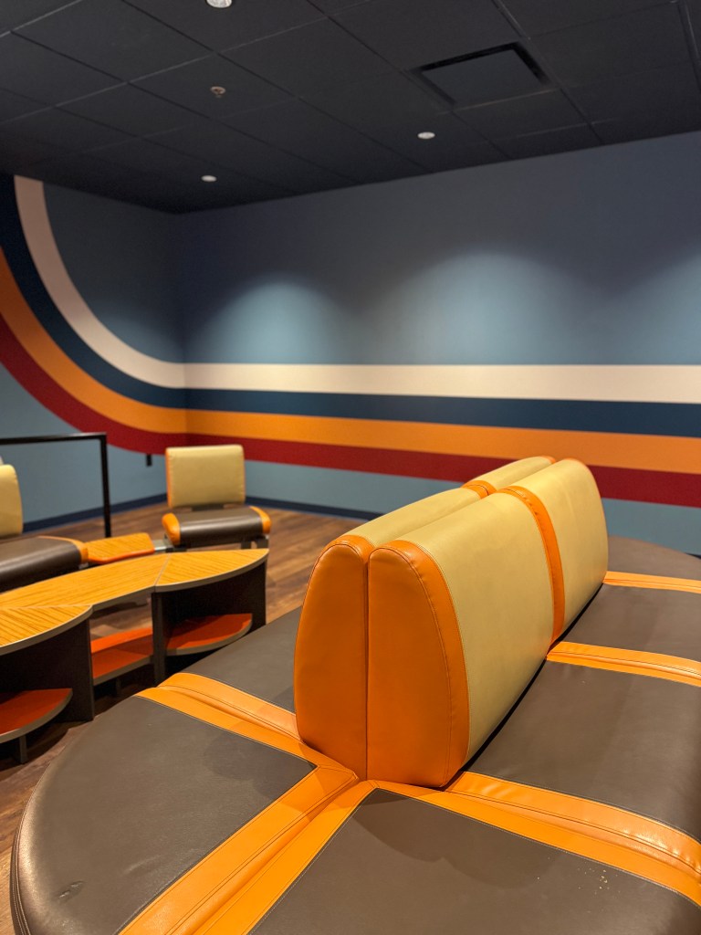 Seating area beside Ten Paw Alley mini bowling at Great Wolf Lodge Grapevine.