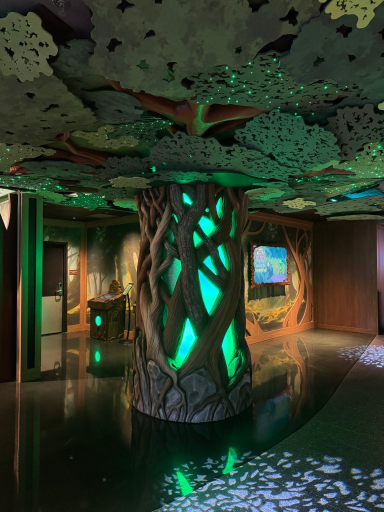 MagiQuest game area at Great Wolf Lodge Grapevine with a glowing enchanted tree and interactive stations.