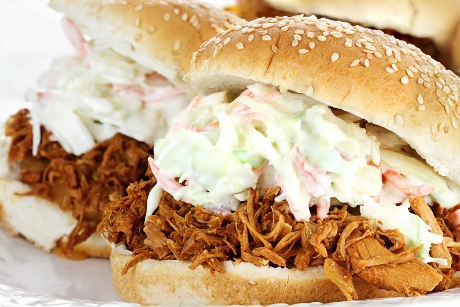 Slow cooker pulled pork with barbecue flavor for sandwiches, sliders, and summer cookouts.