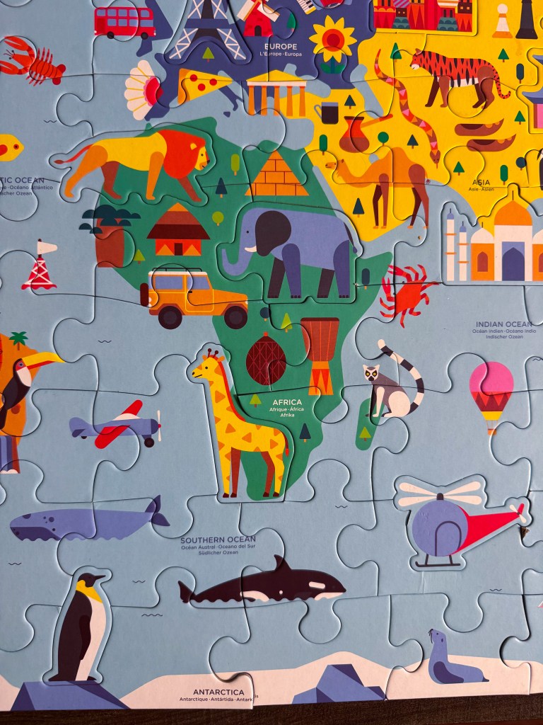 Africa, Europe and Asia shown together on the completed Map of the World Geography Puzzle.