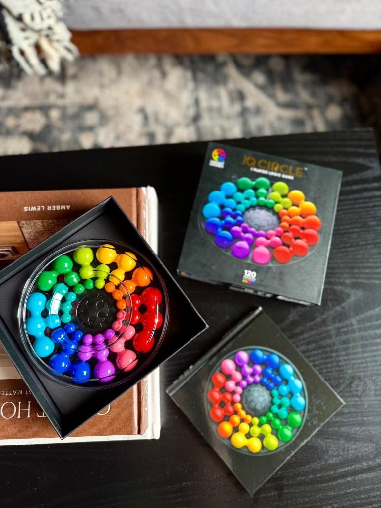 IQ Circle game opened to show the colorful puzzle pieces and circular game board