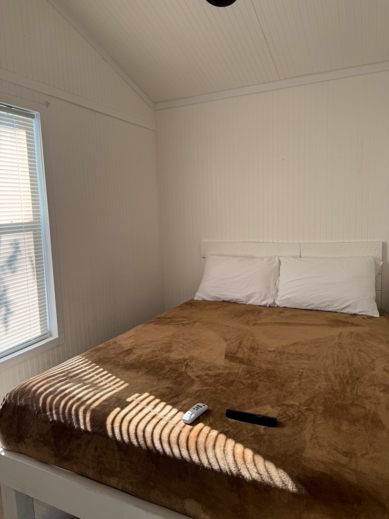 Queen bedroom inside a family cabin at Jellystone Park Pigeon Forge