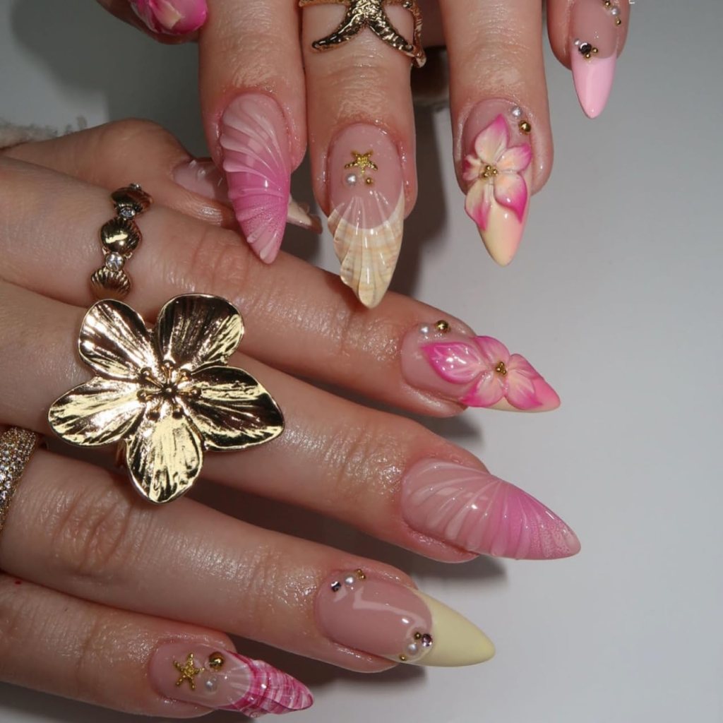 pink seashell acrylic nails with ocean inspired 3d texture
