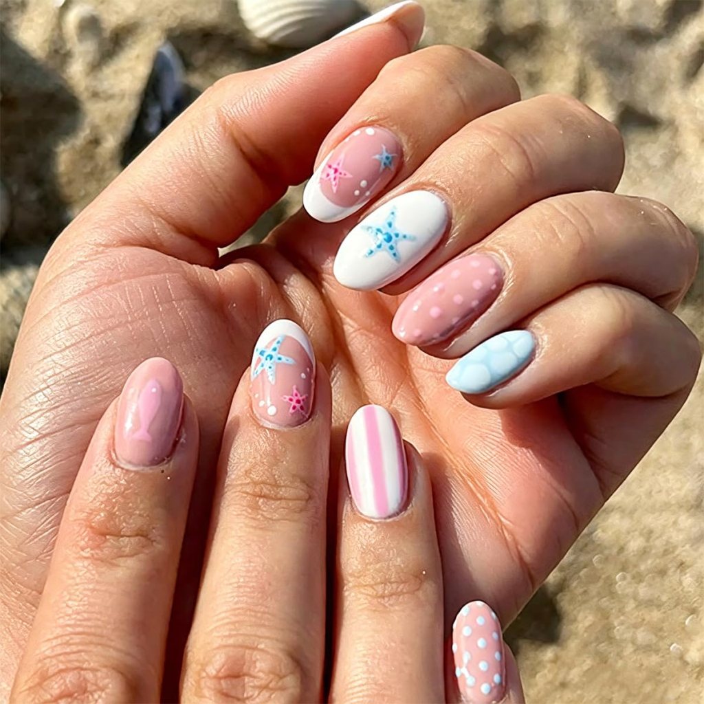 cute pink beach nails with starfish and striped summer pattern
