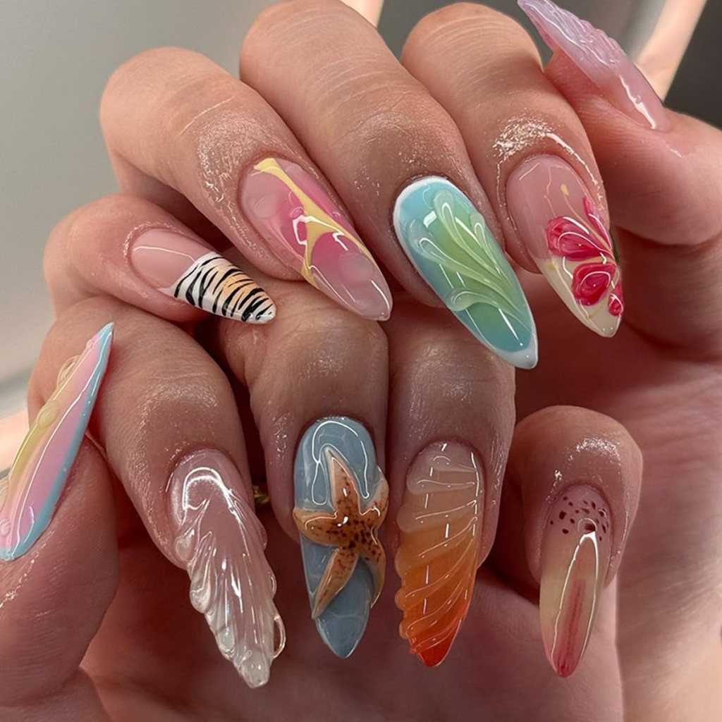 3D seashell ocean acrylic nails with pastel colors, textured shell art, and tropical beach-inspired manicure design