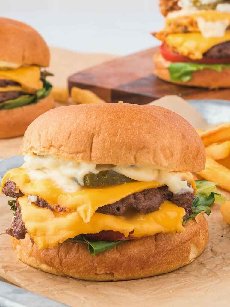 Cheesy smash burgers with crispy edges and toasted buns for an easy summer dinner.